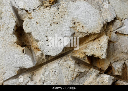 Gli sfondi e texture: ruvido weathered stone texture, la parete esterna o piano dell edificio rustico Foto Stock