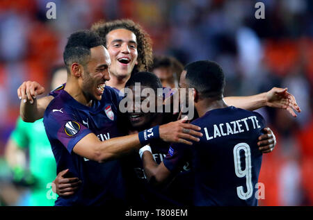 Dell'Arsenal Aubameyang Pierre-Emerick (sinistra), Matteo Guendouzi, Ainsley Maitland-Niles e Alexandre Lacazette celebrare i risultati alla fine della UEFA Europa League, Semi Finale, la seconda gamba al Camp de Mestalla, Valencia. Foto Stock