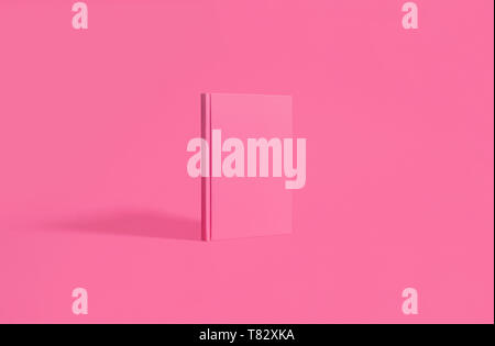 Notebook rosa, diario ufficiale su una corrispondente sfondo rosa con copia e spazio per il testo Foto Stock