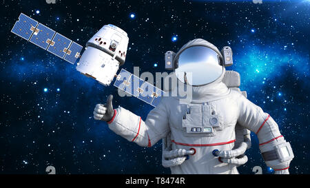 Astronauta con satellite mostra Thumbs up, cosmonauta fluttuante nello spazio di un veicolo spaziale in background, rendering 3D Foto Stock