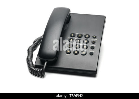 Classico telefono cablato utilizzati a casa e negli uffici su un isolato bianco sullo sfondo. Foto Stock