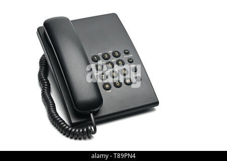 Classico telefono cablato utilizzati a casa e negli uffici su un isolato bianco sullo sfondo. Foto Stock