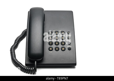 Classico telefono cablato utilizzati a casa e negli uffici su un isolato bianco sullo sfondo. Foto Stock