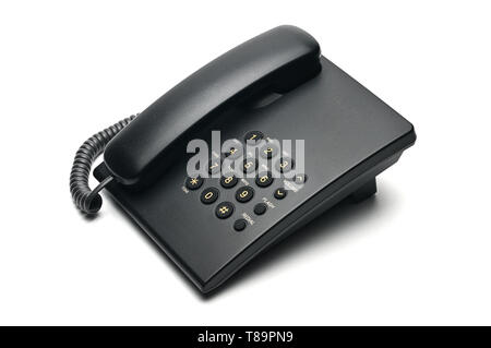 Classico telefono cablato utilizzati a casa e negli uffici su un isolato bianco sullo sfondo. Foto Stock