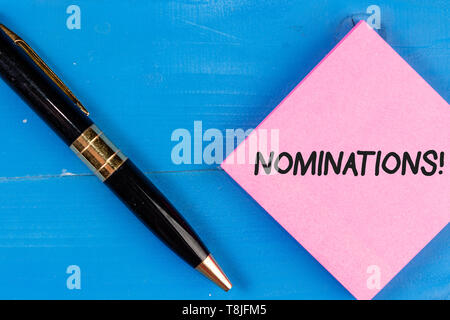 La scrittura della nota mostra le candidature. Il concetto di business per azione di nominare o essendo stato nominato per il premio Foto Stock