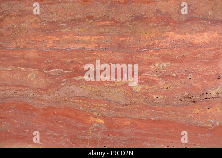 Rosso naturale texture di travertino in contrasto tono. Foto Stock