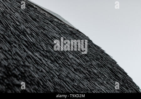 Accuratamente impilati tetto reed. Foto Stock