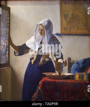 Johannes Vermeer - giovane donna con brocca c 1665 Foto Stock