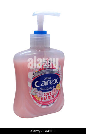 Un azione della pompa bottiglia di rosa Carex Cussons antibatterico per lavaggio a mano - 25 anni edizione divertimento amore cuori isolati su sfondo bianco Foto Stock