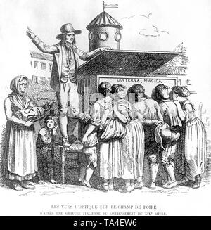 Spettatori ammirare l'immagine creata dalla lanterna magica. Foto Stock