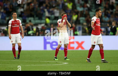 Arsenal giocatori sguardo sconsolato dopo Chelsea Pedro punteggi al suo fianco il secondo obiettivo del gioco durante la UEFA Europa League finale allo Stadio Olimpico, Baku, in Azerbaijan. Foto Stock