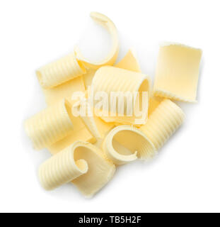 Riccioli di burro su sfondo bianco Foto Stock