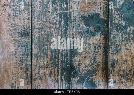 Tavole in legno con vernice incrinata. Vernice blu. Foto Stock