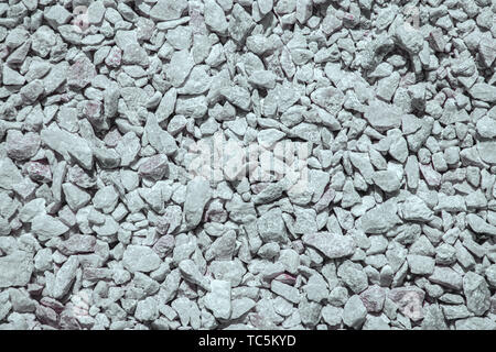 Sfondo di molte grandi e piccole pietre bianche Foto Stock