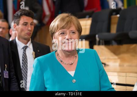 Ginevra, Svizzera. 11 Giugno, 2019. Il cancelliere tedesco Angela Merkel assiste il 108th sessione della Conferenza internazionale del lavoro a Ginevra, Svizzera, 11 giugno 2019. Angela Merkel martedì ha detto che il mondo deve lavorare ulteriormente per migliorare le condizioni di lavoro e di ruotare la crescita economica nel progresso sociale. Credito: Xu Jinquan/Xinhua/Alamy Live News Foto Stock