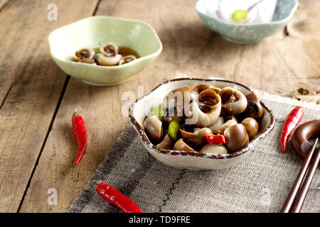 Frutti di mare piccante mare semi di melone lumaca pinze di granchio Foto Stock