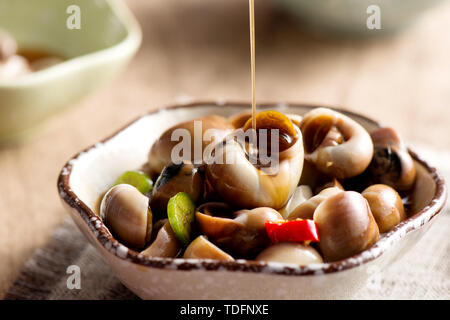 Frutti di mare piccante mare semi di melone lumaca pinze di granchio Foto Stock