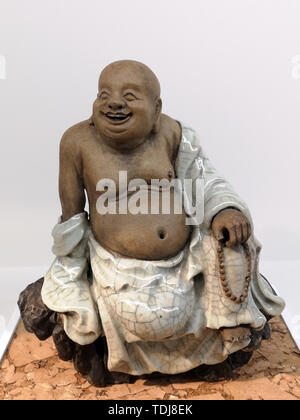 Ceramica statua del Buddha Maitreya Foto Stock