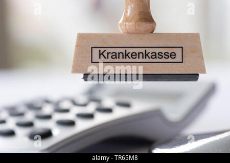 Stampt con etichetta Krankenkasse, assicurazione sanitaria con la calcolatrice, Germania Foto Stock