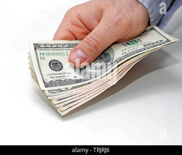 Hundred Dollar Bills denaro in Man mano Foto Stock