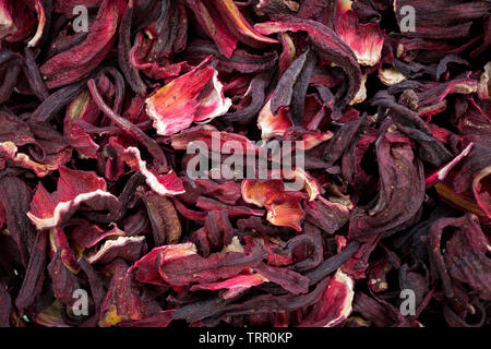 Essiccati fiori di ibisco sfondo alle erbe Foto Stock