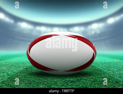 Un bianco reguar pallone da rugby rosso con elementi di design in appoggio su uno stadio campo di erba di notte sotto illuminato washer - 3D render Foto Stock