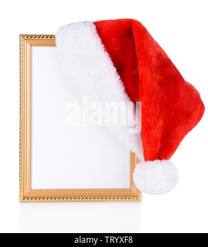 Cappello di Natale appeso sul vecchio telaio isolato su bianco Foto Stock