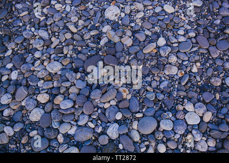 Pietre sul terreno, modello di pietra di sfondo. Foto Stock