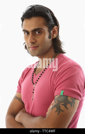 Portrait of a man crossing arms Foto Stock