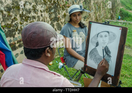 La caricatura Artista al Forte Galle, Galle, Sri Lanka Foto Stock