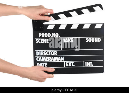 Mani femminili holding movie clapper isolato su bianco Foto Stock