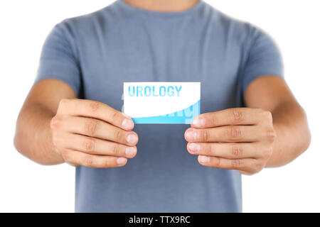 Uomo con business card. Concetto di urologia Foto Stock