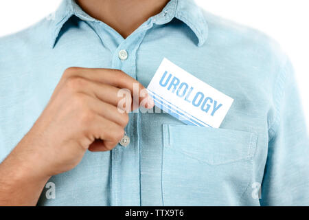 Uomo con business card. Concetto di urologia Foto Stock