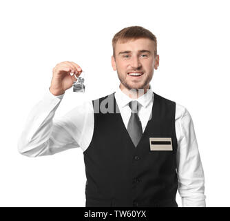 Hotel maschio receptionist con la chiave della camera su sfondo bianco Foto Stock