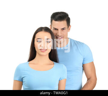 Giovane uomo e donna in elegante t-shirt su sfondo bianco. Mockup per la progettazione Foto Stock