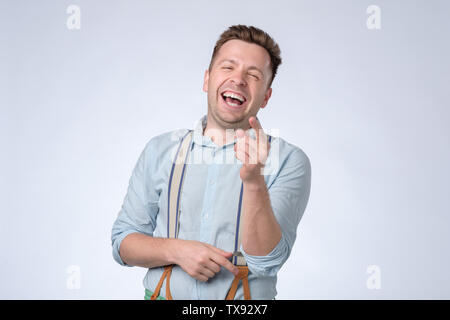 Ritratto di un bel giovane ridendo Foto Stock