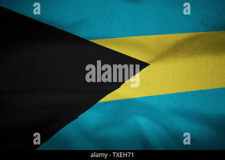 Increspato bandiera delle Bahamas soffiando nel vento Foto Stock