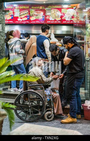 Beggar in strada di Amman in Giordania Foto Stock