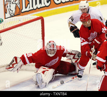 Detroit Red Wings goalie Dominik Hasek, (39) of Czech Republic, is  congratulated by teammates Pavel Datsyuk, right, of Russia, Dallas Drake,  and Mikael Samuelsson, left, of Sweden, after defeating the Buffalo Sabres