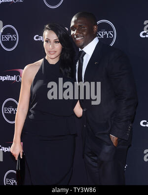 Lettore di NFL Reggie Bush e la sua fidanzata DISPOSITIVO HIRON JARAC JUPITER BASSA LILIT Avagyan frequentare il 2013 ESPY Awards presso il Nokia Theatre di Los Angeles Vive a Los Angeles il 17 luglio 2013. UPI/Jim Ruymen Foto Stock