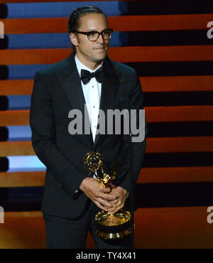 Cary Fukunaga accetta il premio per il miglior regia per una serie di dramma per il suo lavoro su "vero detective' - 'chi ci va' durante il Primetime Emmy Awards presso il Nokia Theatre di Los Angeles il 25 agosto 2014. UPI/Pat Benic Foto Stock