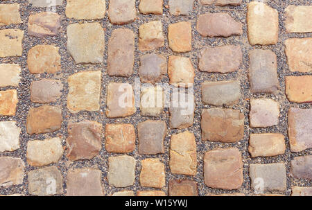 Vecchia strada in ciottoli di grosse pietre. Foto Stock