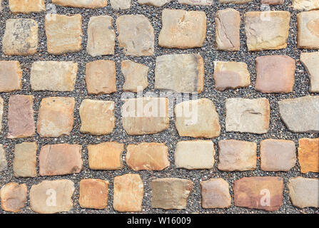 Vecchia strada in ciottoli di grosse pietre. Foto Stock