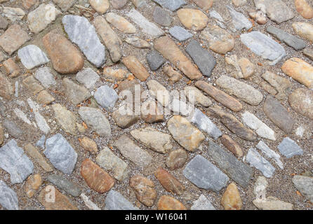 Vecchia strada in ciottoli di grosse pietre. Foto Stock