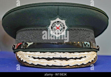 Una foto di stock della PAC e il logo della nuova PSNI CHIEF CONSTABLE Simon Byrne. Foto Stock