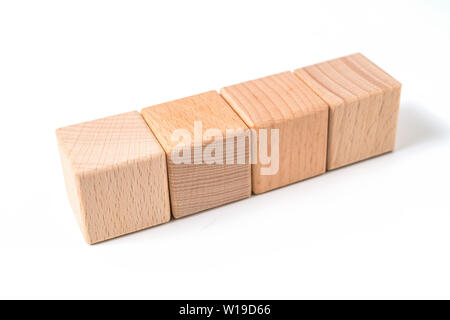 Il concetto di business - geometrica astratta real floating cubo di legno su sfondo grigio e non è 3D render Foto Stock