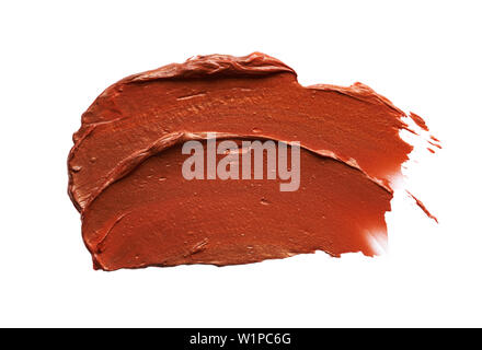 Macchie e texture di bronzo lip gloss isolati su sfondo bianco Foto Stock