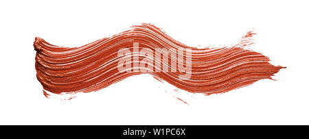 Macchie e texture di bronzo lip gloss isolati su sfondo bianco Foto Stock