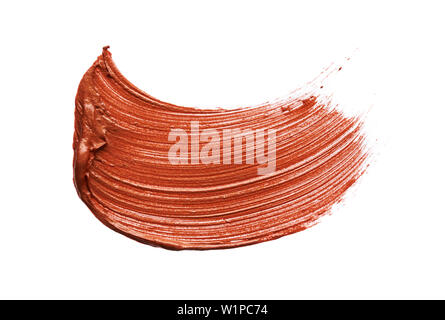 Macchie e texture di bronzo lip gloss isolati su sfondo bianco Foto Stock
