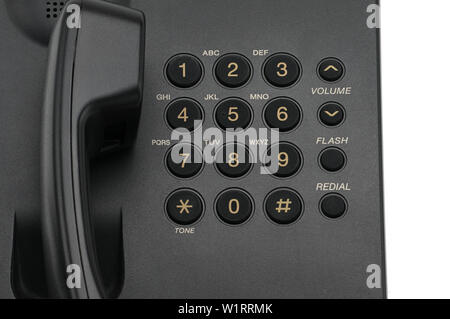 Classico telefono cablato utilizzati a casa e negli uffici su un isolato bianco sullo sfondo. Foto Stock